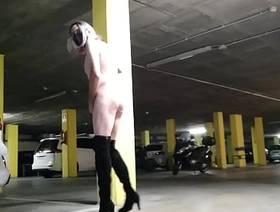 Naked sissy masturbating in a dark public space