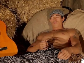 Gay asian muscle guitarist plays with cock on the hay